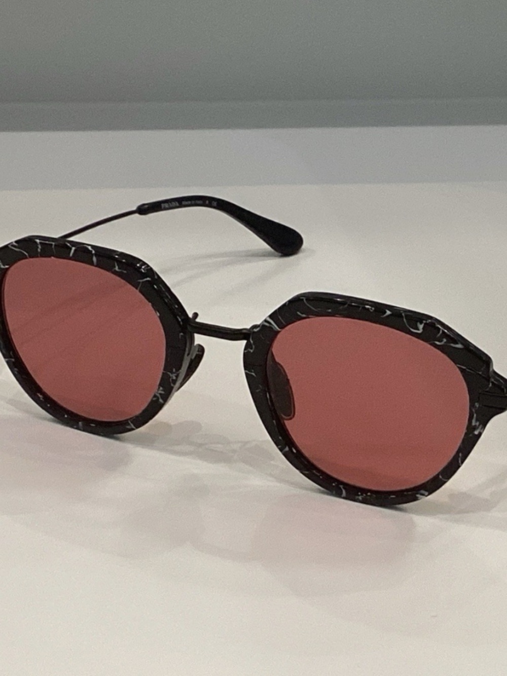 PRADA EYEWEAR SPR05Y Unisex Round Polarized Sunglasses MarbleBlack/Red 50-24-145